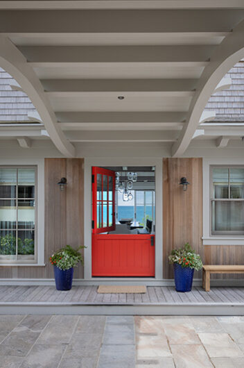 Entry door with view to ocean horizon by Hutker Architects
